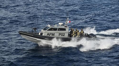 FILE - Members of the Maltese armed forces escort the catamaran carrying Pope Francis and leaving Valletta's harbor for Gozo in Malta Saturday, April 2, 2022. Rescue groups are accusing the European Island nation of Malta of coordinating the return of around 500 people to Libya where they were subsequently imprisoned, in violation of international maritime law. (Andreas Solaro/Pool via AP, File)